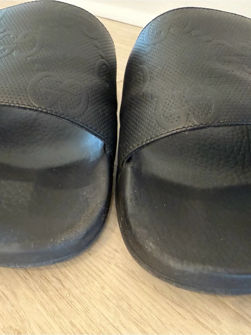 Men’s Gucci Black Embossed GG Slide Sandals